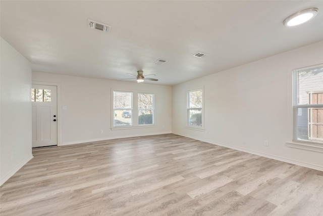 empty room featuring ceiling fan and light hardwood / wood-style flooring