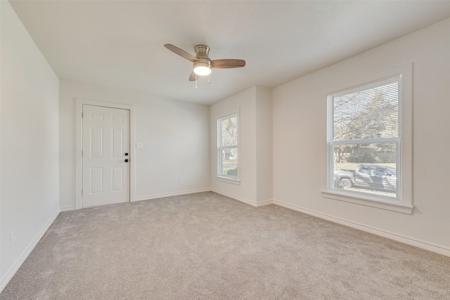 carpeted empty room with ceiling fan