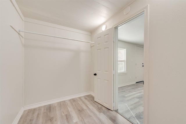 spacious closet featuring light hardwood / wood-style floors