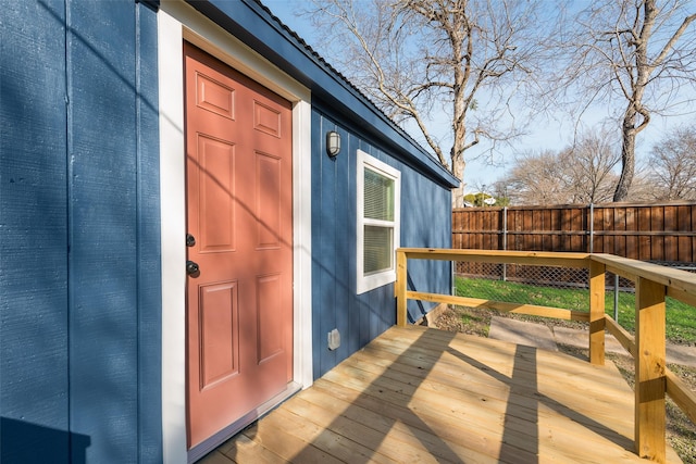 property entrance featuring a wooden deck