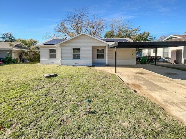 ranch-style home featuring a carport and a front lawn