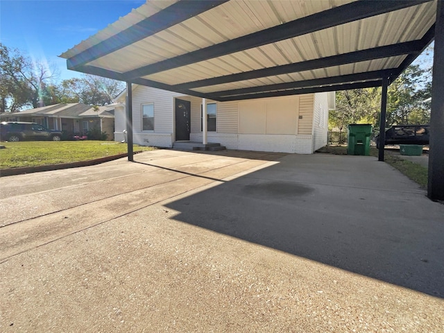 exterior space with a front yard and a carport