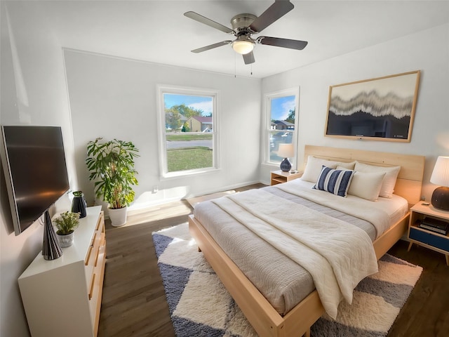 bedroom featuring dark wood-type flooring and ceiling fan