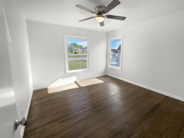 unfurnished room featuring dark hardwood / wood-style floors and ceiling fan