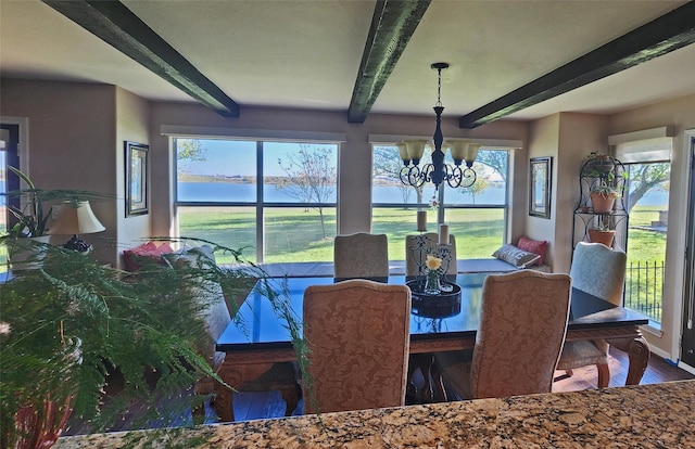 dining room with beamed ceiling, hardwood / wood-style floors, and an inviting chandelier