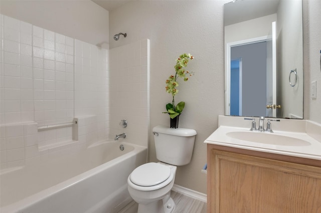 full bathroom featuring vanity, toilet, and washtub / shower combination