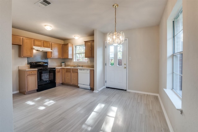 kitchen featuring dishwasher, black electric range oven, sink, hanging light fixtures, and a chandelier