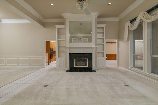 unfurnished living room with a fireplace, light colored carpet, and crown molding