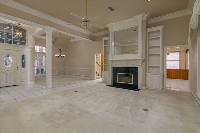 unfurnished living room with light carpet, crown molding, and a high end fireplace