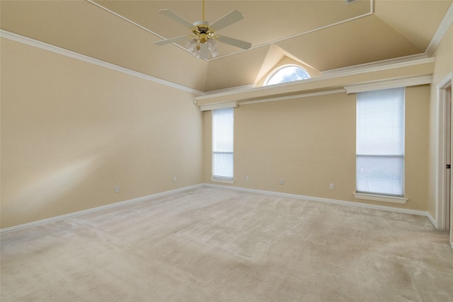 carpeted empty room featuring high vaulted ceiling, ceiling fan, crown molding, and a wealth of natural light