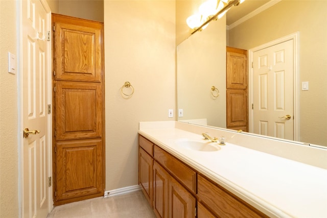 bathroom with crown molding and vanity