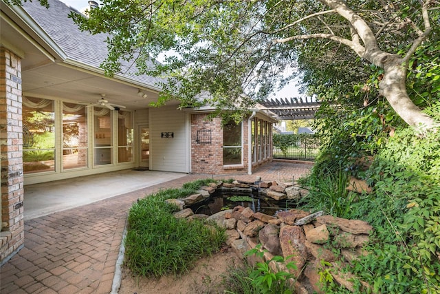 view of yard with a pergola, a patio area, and ceiling fan