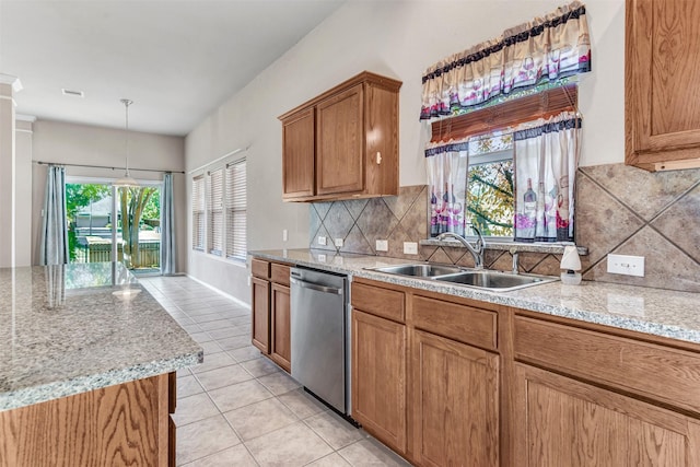 kitchen with dishwasher, pendant lighting, a wealth of natural light, and sink