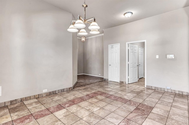 spare room with a chandelier