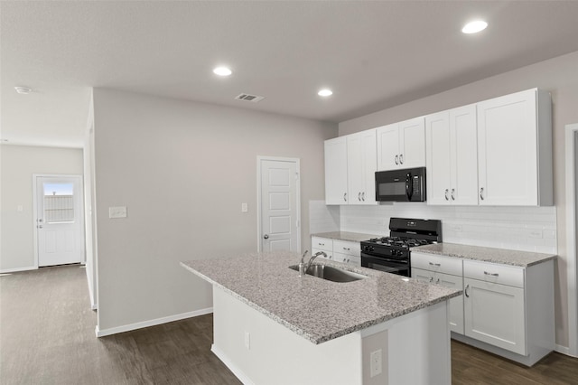 1906 Sweetwater Dr, Forney, TX 75126 - kitchen featuring visible vents, black appliances, a sink, tasteful backsplash, and dark wood finished floors