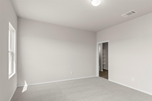 1906 Sweetwater Dr, Forney, TX 75126 - empty room featuring baseboards, visible vents, carpet floors, and a healthy amount of sunlight