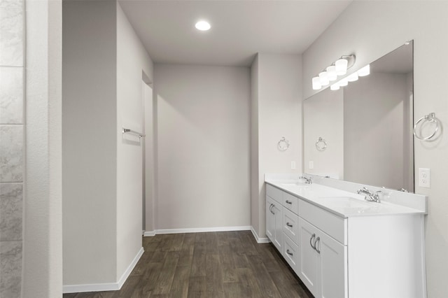 1906 Sweetwater Dr, Forney, TX 75126 - full bathroom featuring a sink, baseboards, wood finished floors, and double vanity