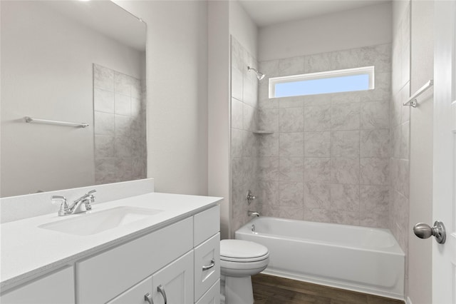 1906 Sweetwater Dr, Forney, TX 75126 - bathroom with toilet, vanity,  shower combination, and wood finished floors