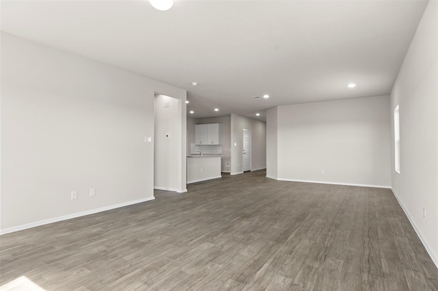 1906 Sweetwater Dr, Forney, TX 75126 - unfurnished living room with recessed lighting, baseboards, and wood finished floors