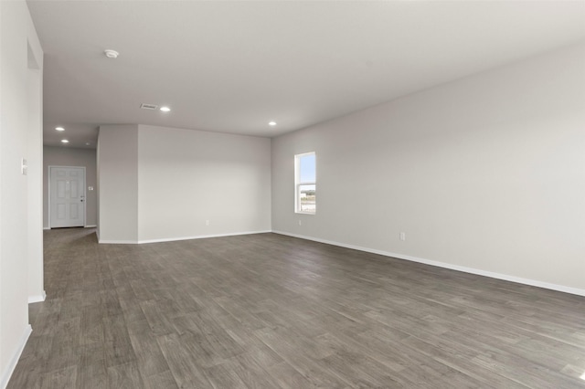 1906 Sweetwater Dr, Forney, TX 75126 - empty room featuring dark wood finished floors, visible vents, recessed lighting, and baseboards