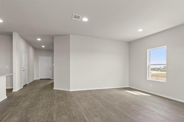1906 Sweetwater Dr, Forney, TX 75126 - spare room featuring dark wood finished floors, visible vents, recessed lighting, and baseboards