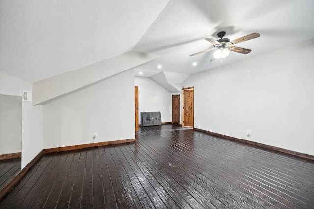 bonus room with ceiling fan, dark wood-type flooring, and lofted ceiling