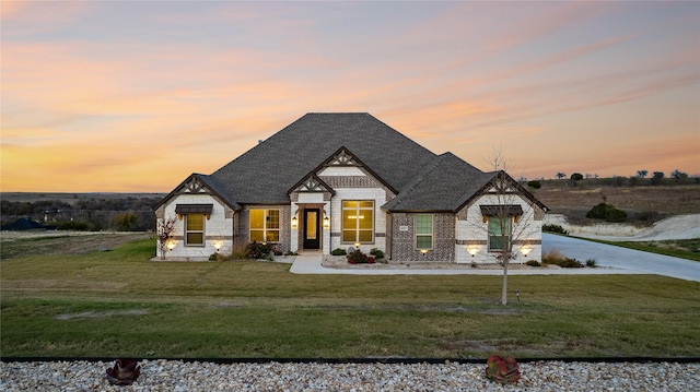 view of front of home with a yard