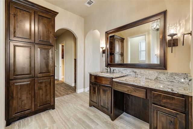 bathroom featuring hardwood / wood-style floors and vanity