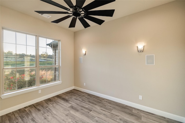 empty room with light hardwood / wood-style floors and ceiling fan