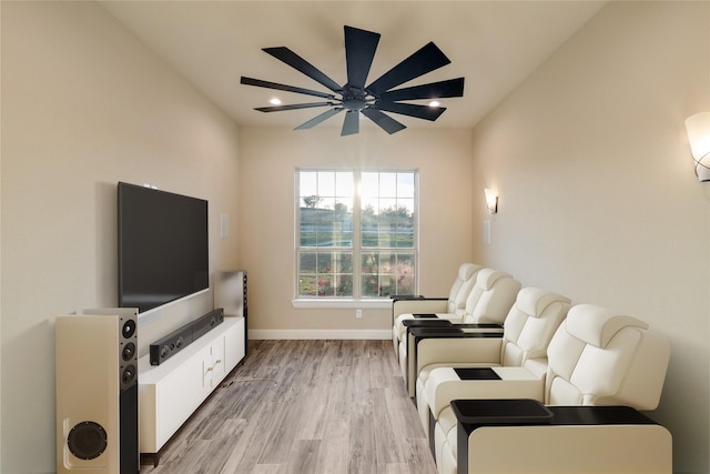 living room with light wood-type flooring and ceiling fan