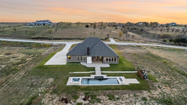 aerial view at dusk with a rural view