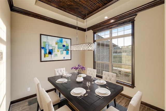 dining space with crown molding, wooden ceiling, and wood-type flooring