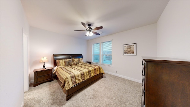 bedroom featuring ceiling fan and light colored carpet