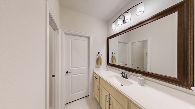 bathroom with tile patterned floors and vanity