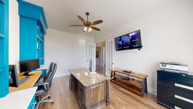 office area with french doors, light hardwood / wood-style flooring, and ceiling fan