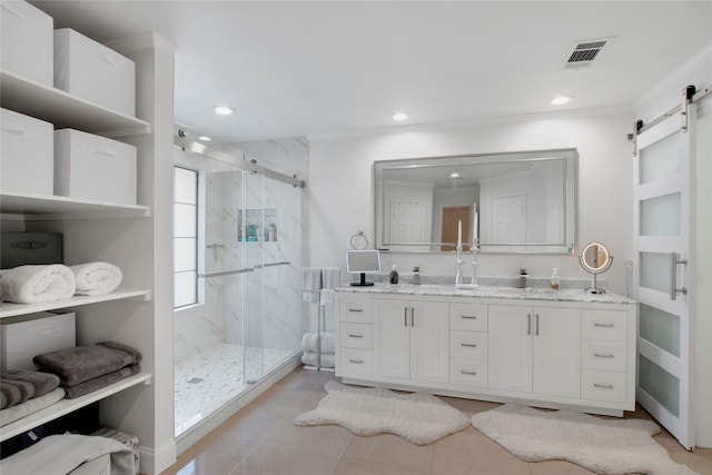 bathroom with tile patterned flooring, vanity, walk in shower, and crown molding