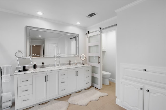 bathroom featuring tile patterned floors, vanity, toilet, and ornamental molding