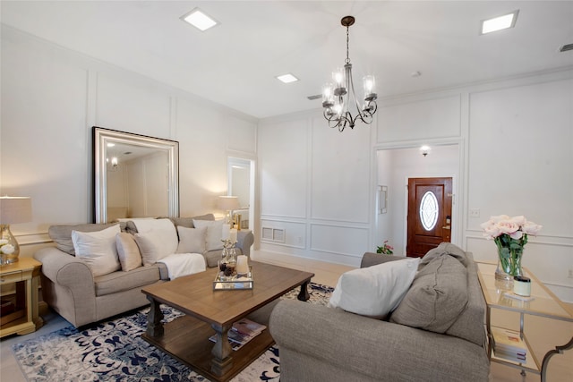 living room featuring ornamental molding and an inviting chandelier