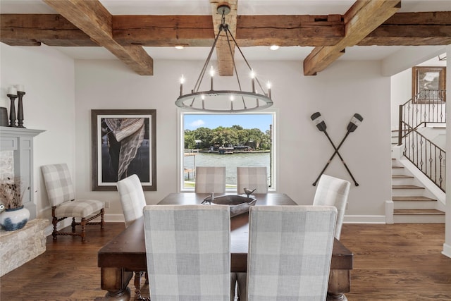 dining space with beam ceiling, dark hardwood / wood-style flooring, a water view, and a notable chandelier