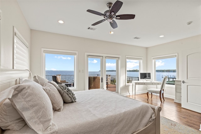 bedroom featuring access to outside, ceiling fan, and wood-type flooring