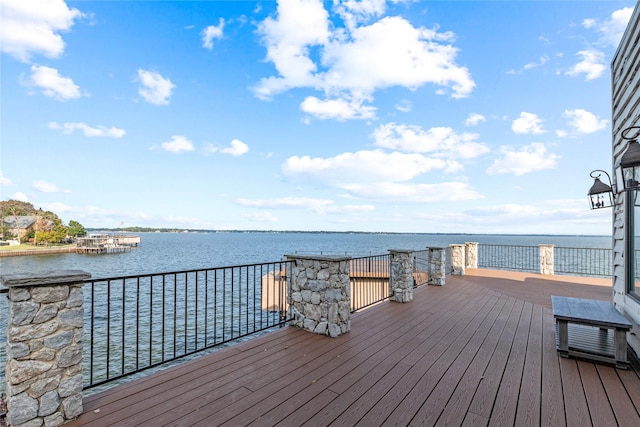 wooden terrace with a water view