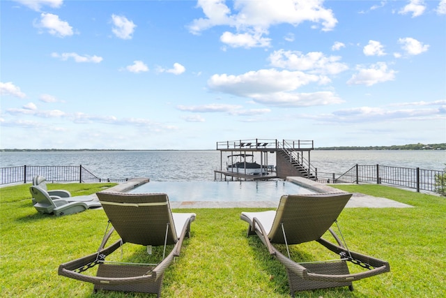 dock area featuring a yard and a water view