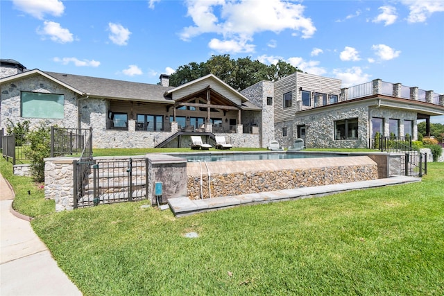 rear view of property with a lawn