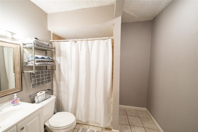 bathroom featuring tile patterned floors, walk in shower, vanity, a textured ceiling, and toilet