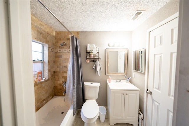 bathroom featuring curtained shower, vanity, a textured ceiling, and toilet