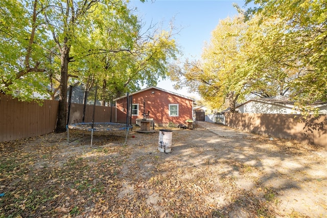 view of yard with a trampoline