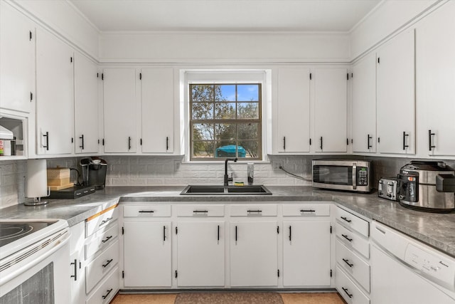 kitchen with white cabinetry, sink, crown molding, white appliances, and decorative backsplash