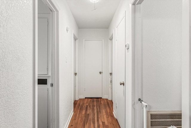 hall featuring dark hardwood / wood-style floors