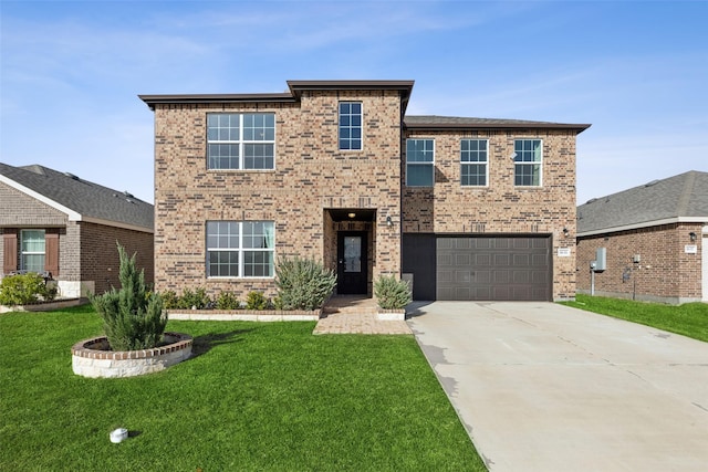 view of front facade featuring a garage and a front lawn