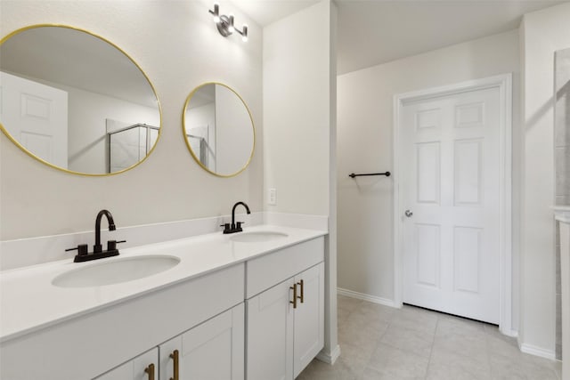 bathroom featuring tile patterned floors and vanity